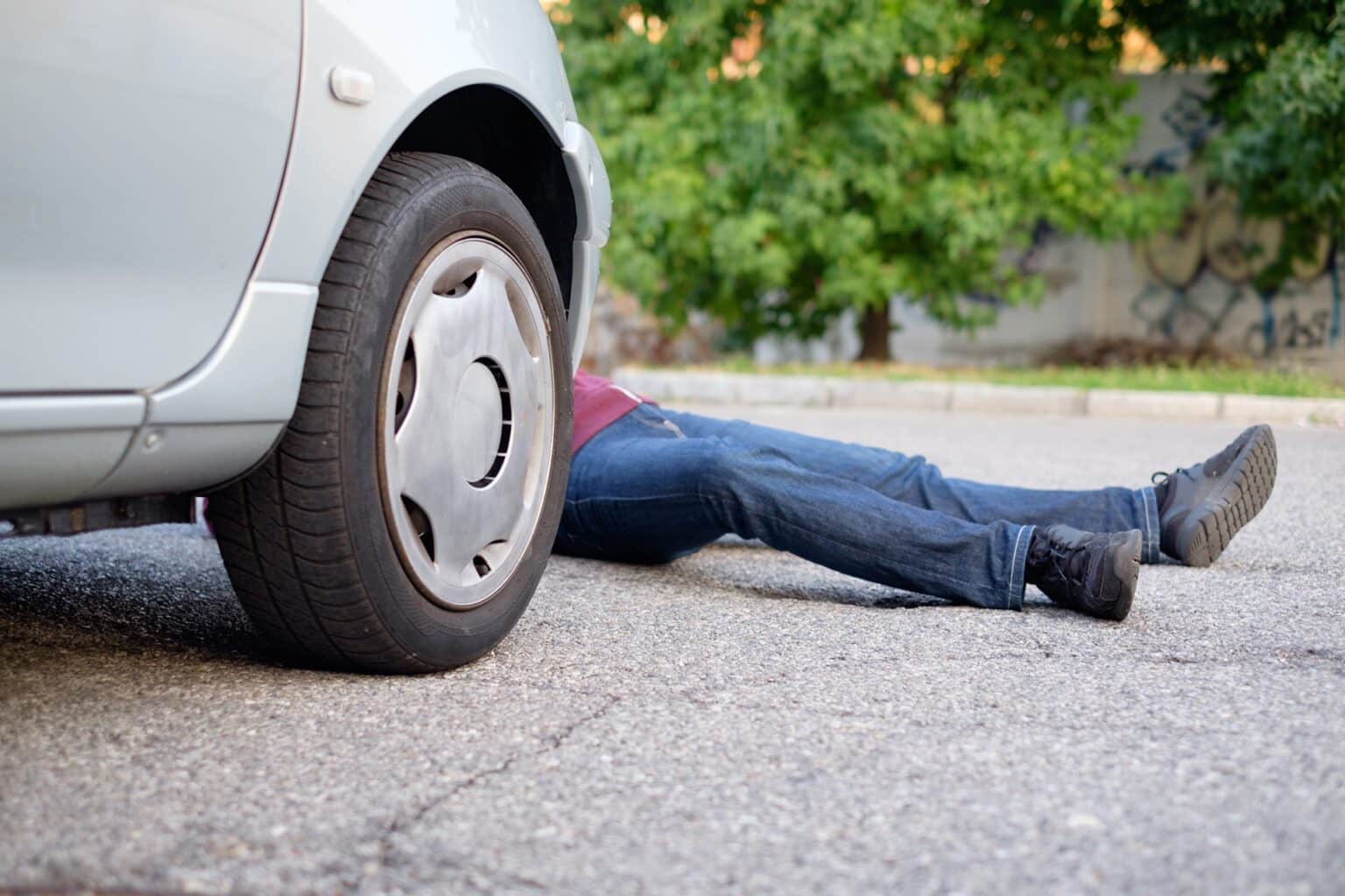 Dead pedestrian after a car accident in the street